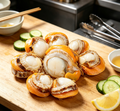 Plump scallop meat with the bright orange roe still attached